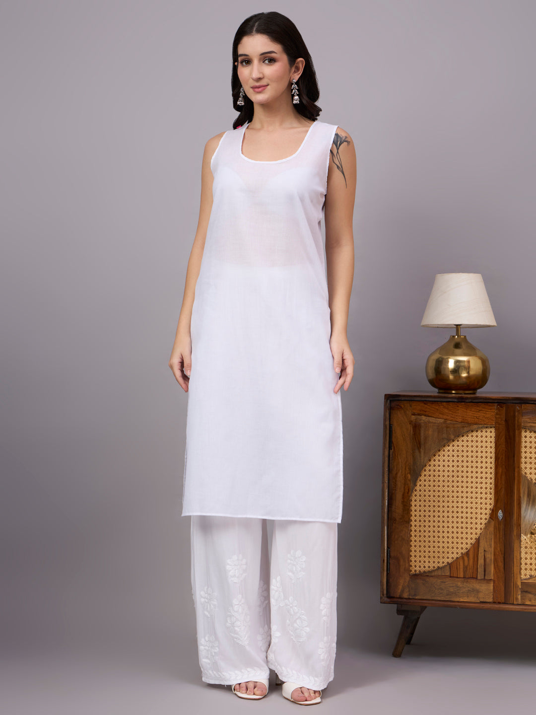 Women's trending kurti featuring handcrafted Lucknow Chikankari embroidery, premium cotton construction, soft inner lining, and elegant straight-fit styling.
