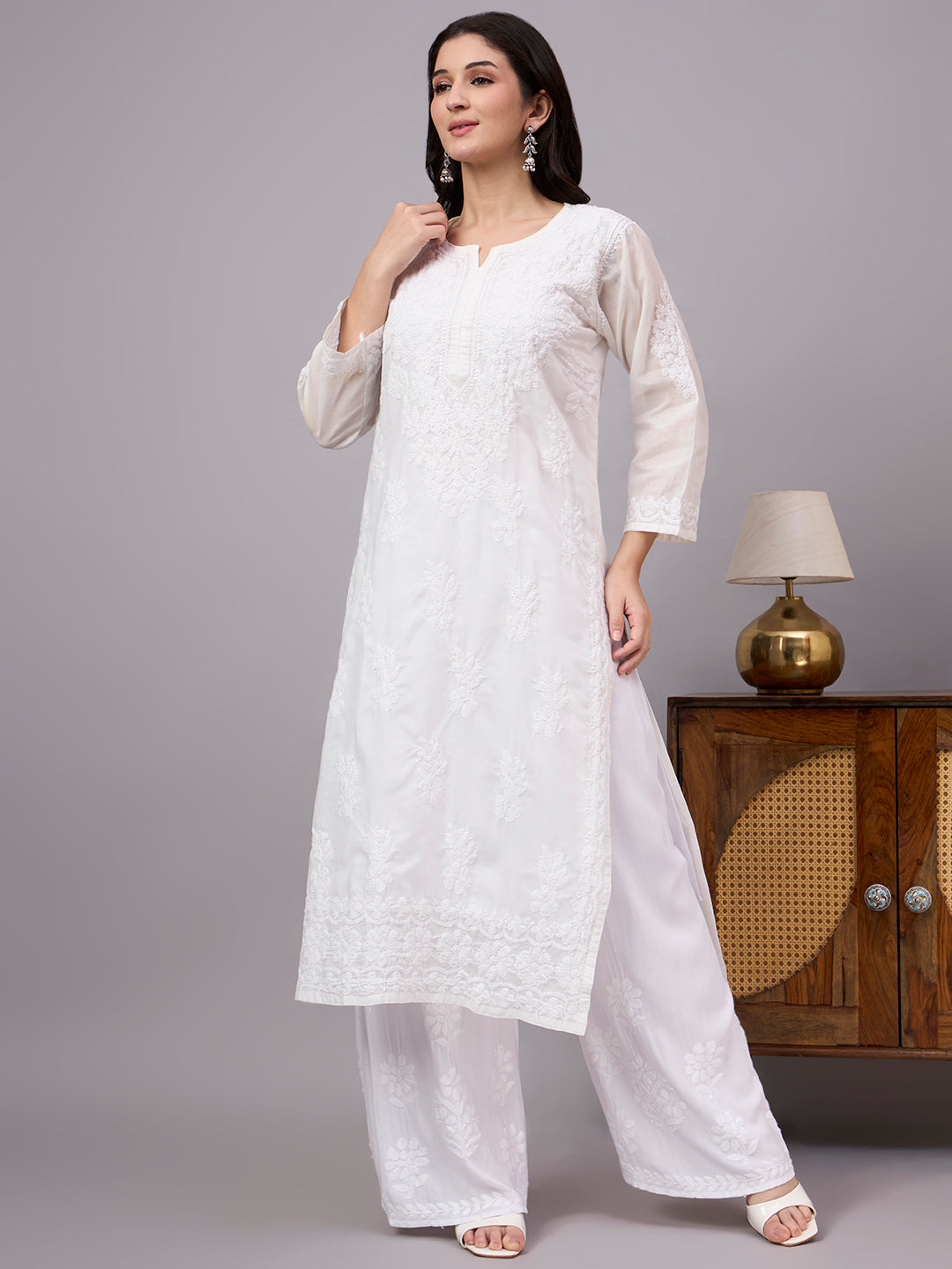 Women's handcrafted Cotton Straight Kurti with authentic floral Chikankari embroidery, comfortable regular fit, and breathable fabric for daily wear and festive occasions.
