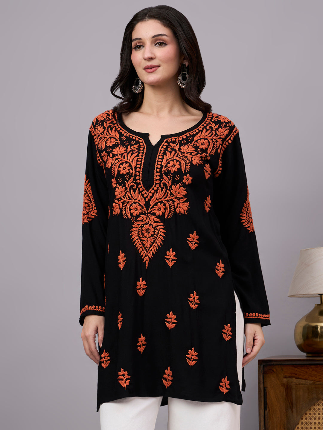 Women's handcrafted Chikankari kurti designed with detailed floral embroidery, premium rayon material, and a relaxed fit suitable for office wear and casual outings.
