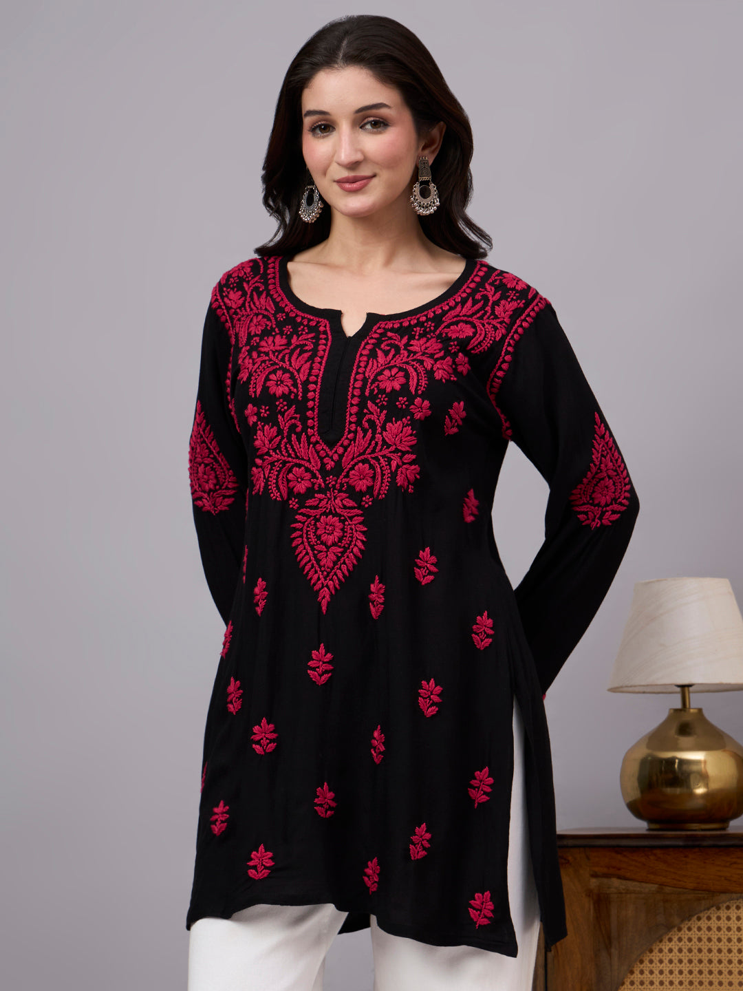 Authentic Chikankari kurti featuring intricate embroidery patterns, breathable rayon fabric, full sleeves, and a fashionable short-length ethnic design.