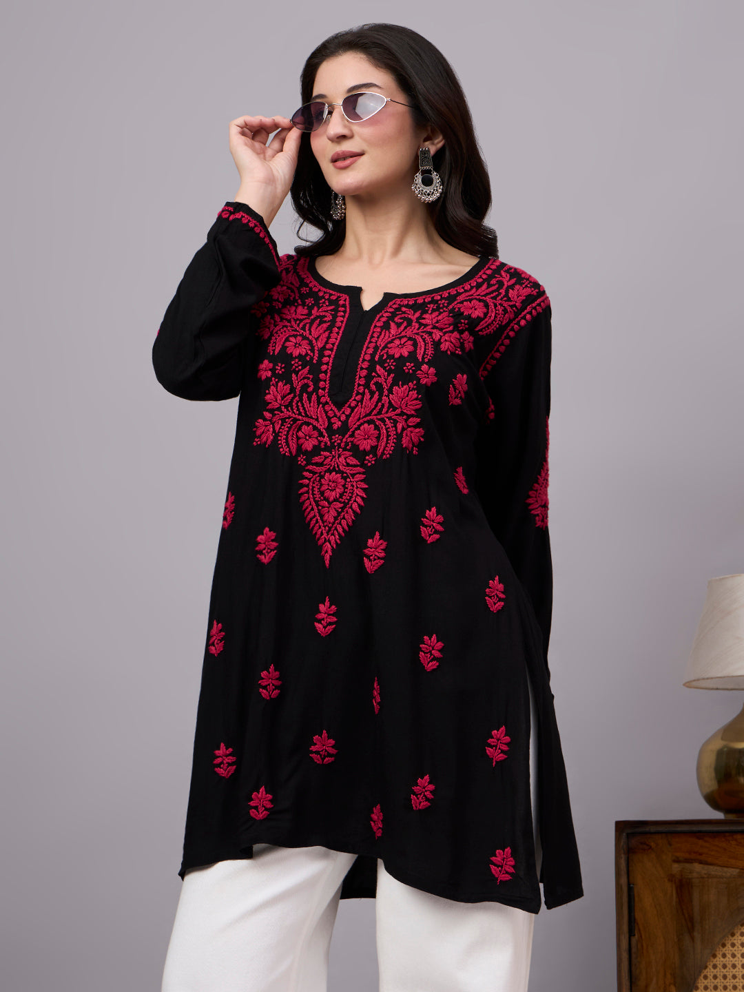 Premium trending short kurti designed with authentic Chikankari embroidery, breathable rayon construction, and a flattering fit for contemporary styling.