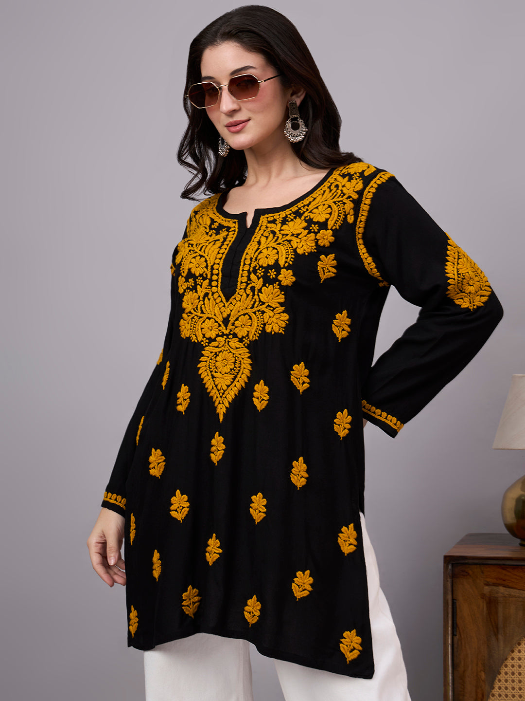 Women's handcrafted Chikankari kurti designed with detailed floral embroidery, premium rayon material, and a relaxed fit suitable for office wear and casual outings.