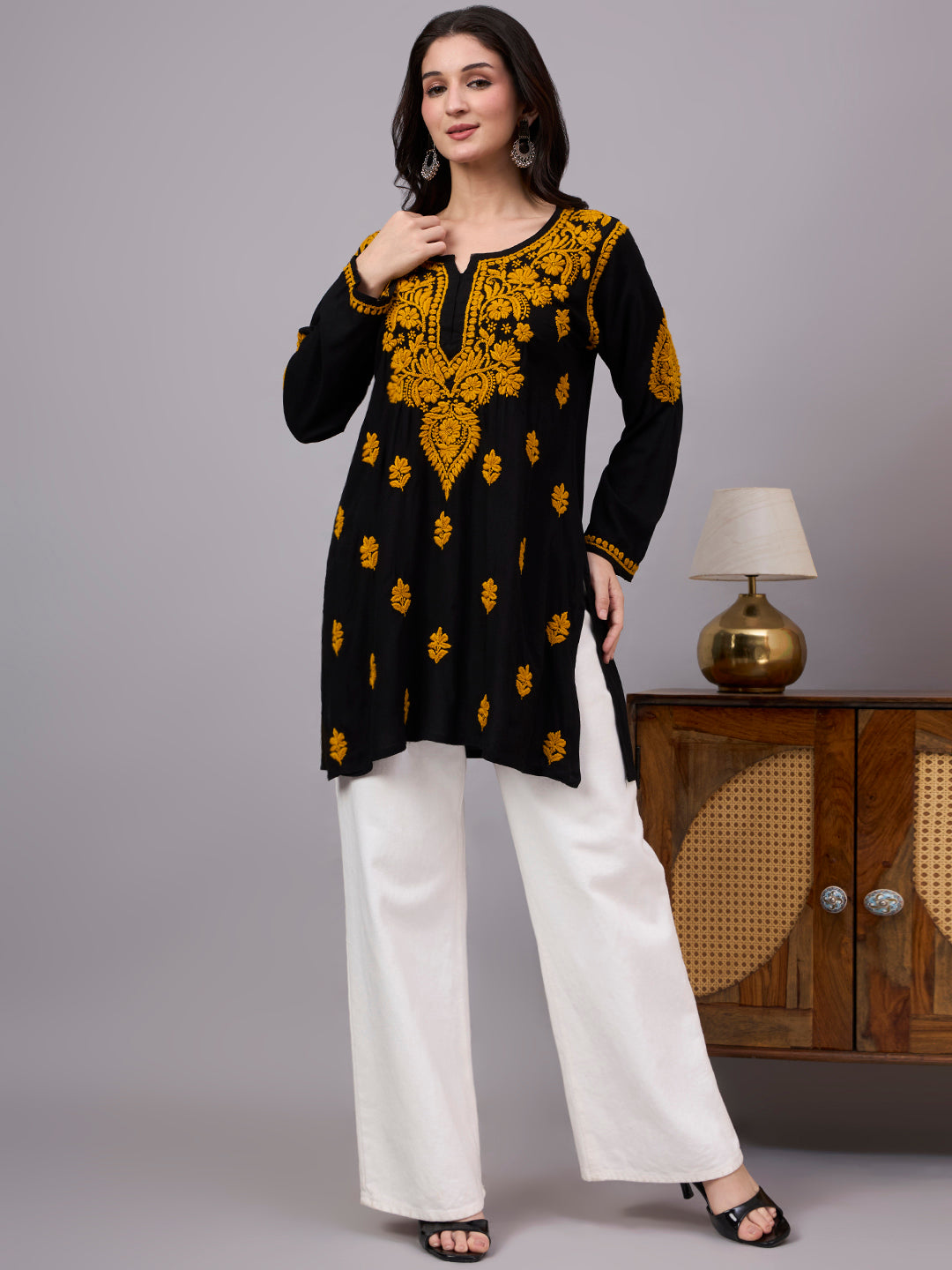 Comfortable regular wear top featuring authentic handcrafted Chikankari embroidery, lightweight rayon fabric, and a trendy short kurti design for effortless styling.
