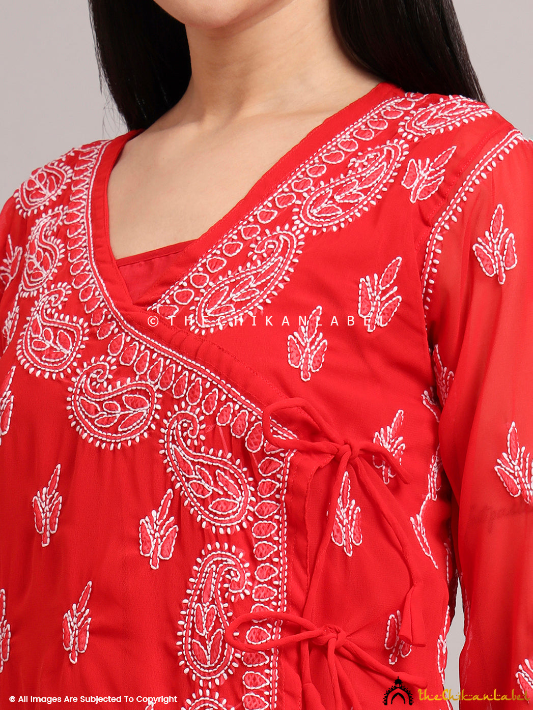 Woman wearing a georgette Angrakha kurta with handcrafted Chikankari embroidery styled for summer wear and casual elegance