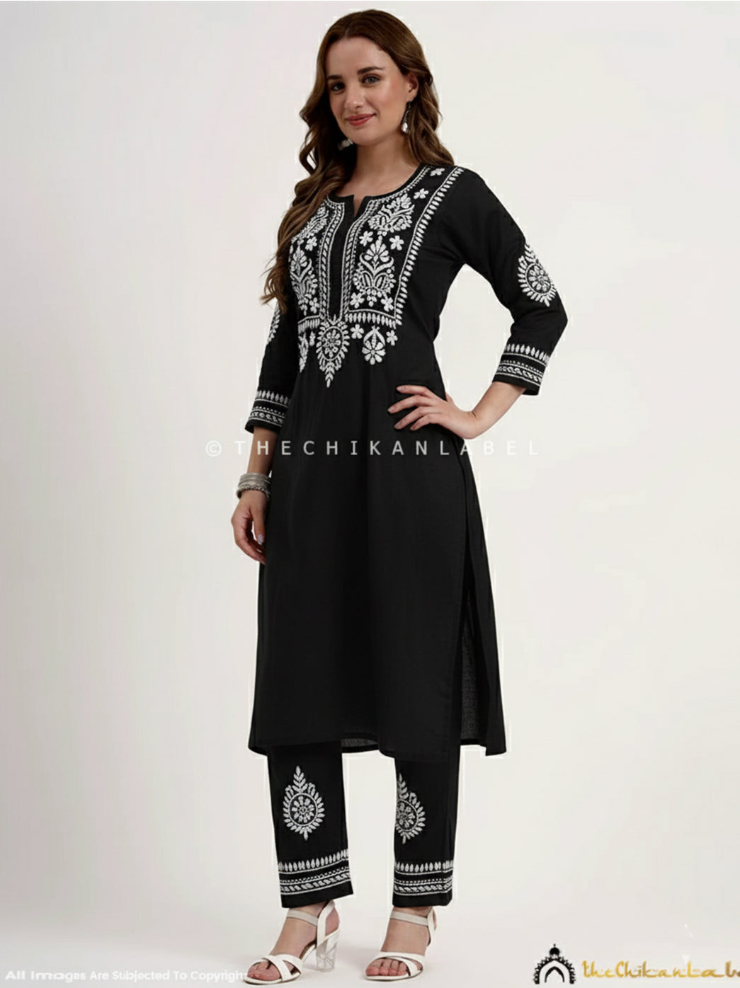 Handcrafted cotton chikankari outfit set showcasing floral embroidery work perfect for ethnic functions and daily wear