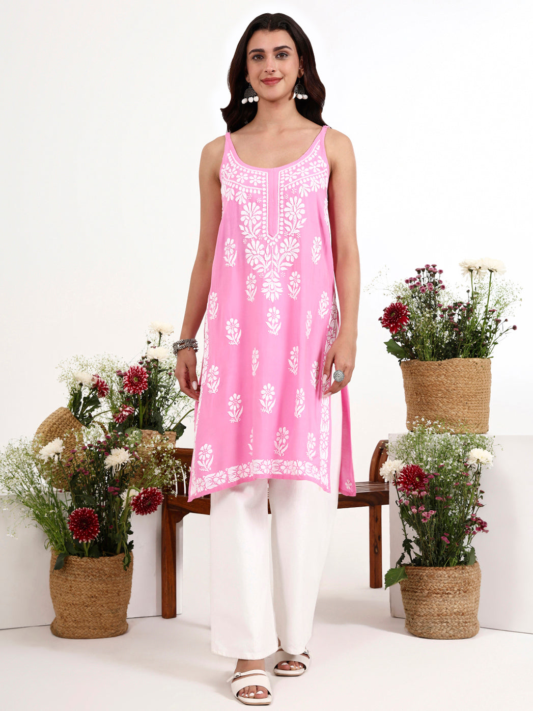 Women wearing chikankari strappy kurta with detailed floral embroidery and modern silhouette