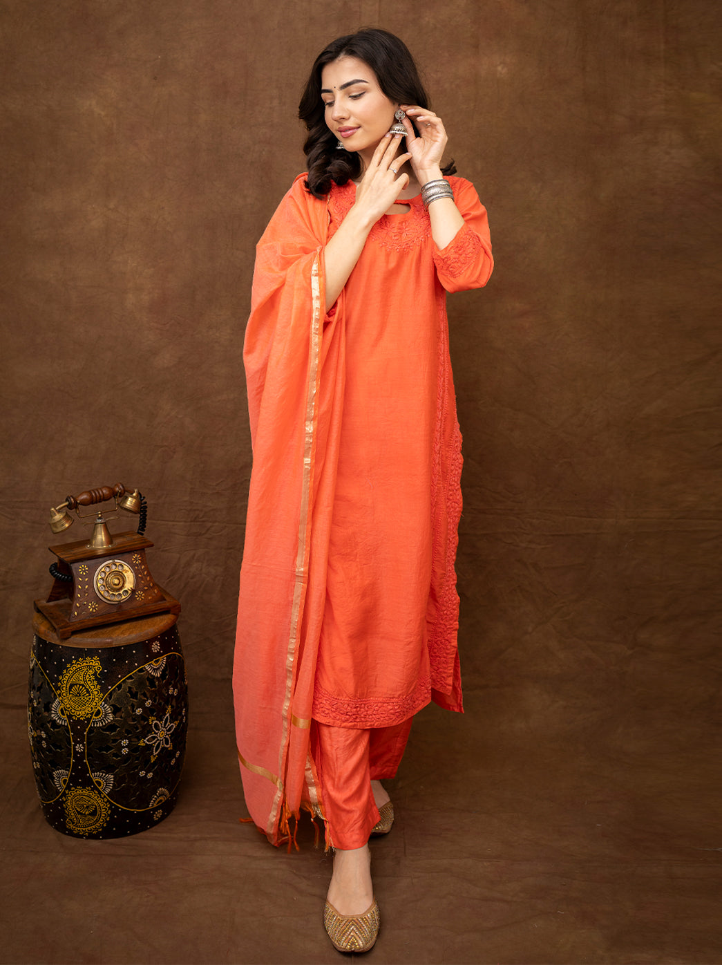 Elegant festive wear chikankari kurta set with dupatta styled with traditional accessories for ethnic gatherings
