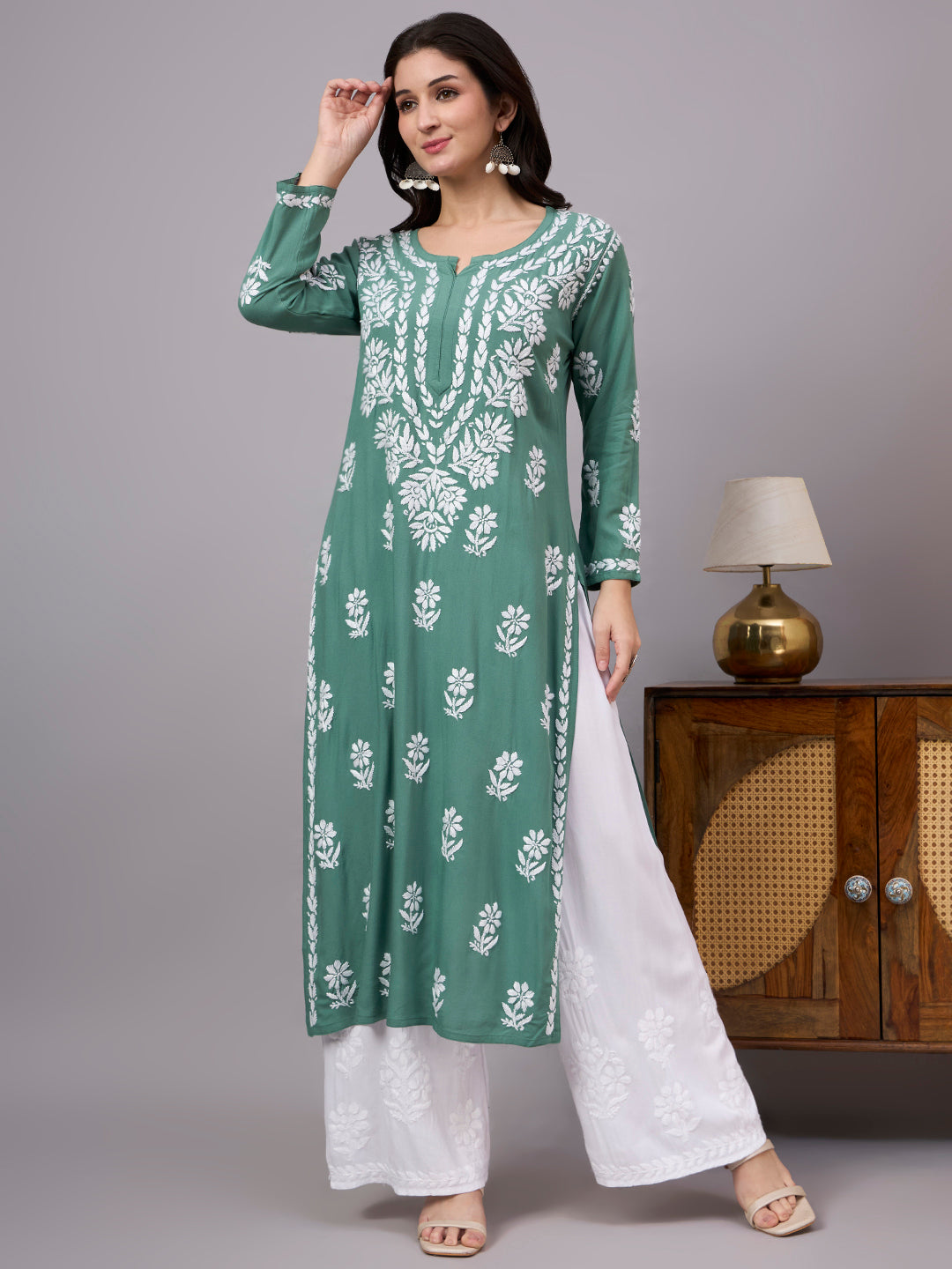 Stylish Rayon Straight Kurti with handcrafted Chikankari embroidery, comfortable regular fit, breathable fabric, and classic ethnic appeal for women seeking timeless fashion.
