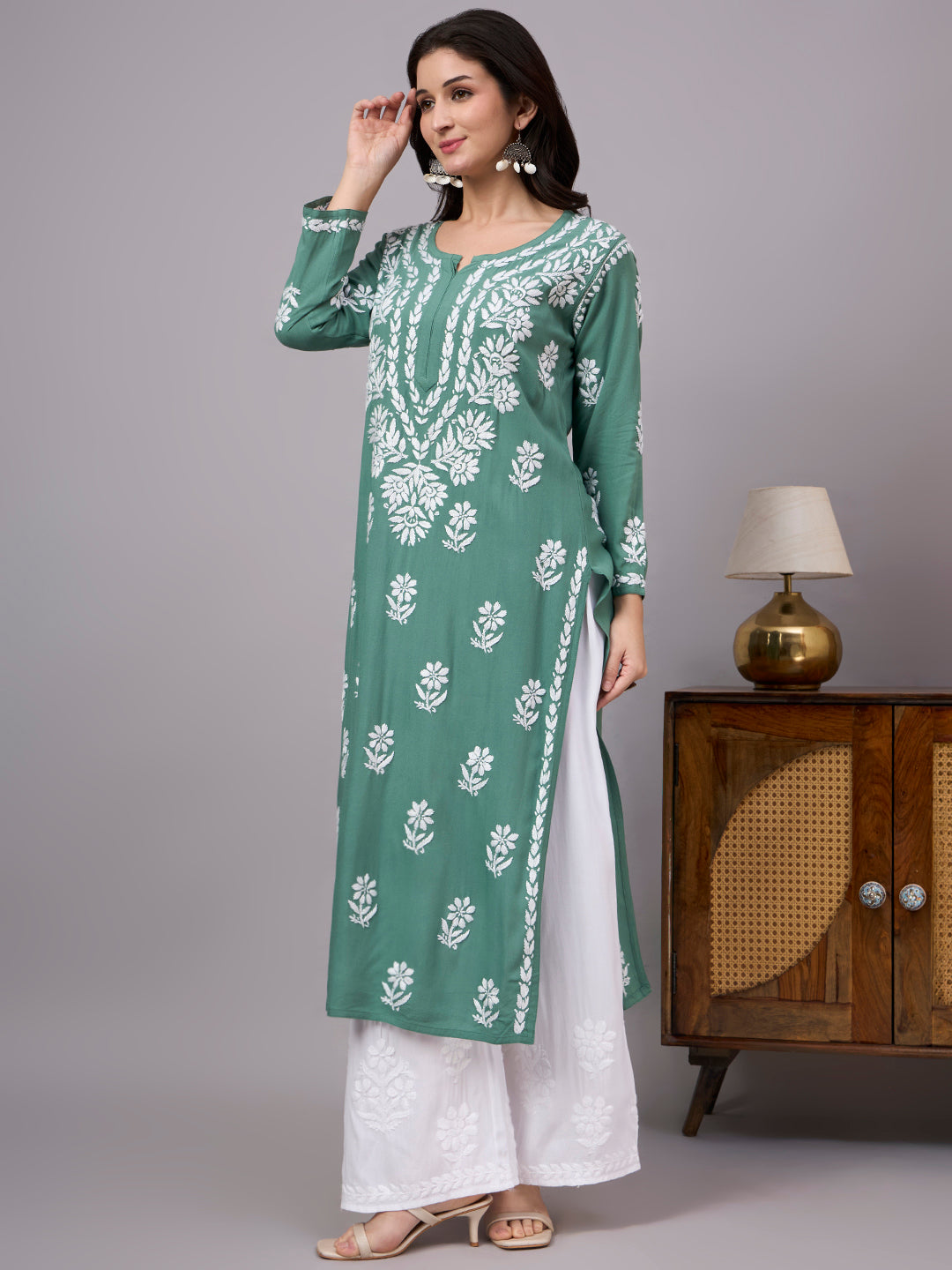 Premium ethnic Rayon Straight Kurti with handcrafted floral Chikankari embroidery, lightweight fabric, and comfortable design ideal for daily wear and special occasions.
