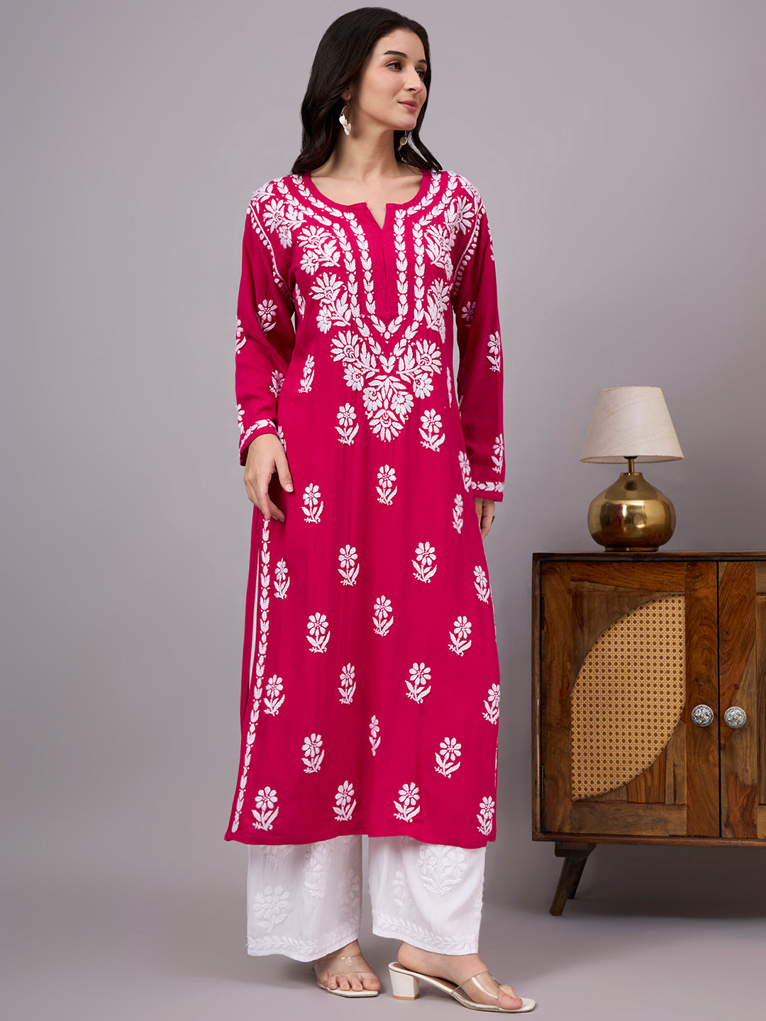 Comfortable regular wear kurti with handcrafted Chikankari embroidery, breathable rayon fabric, classic straight silhouette, and versatile styling for work, travel, and everyday fashion.