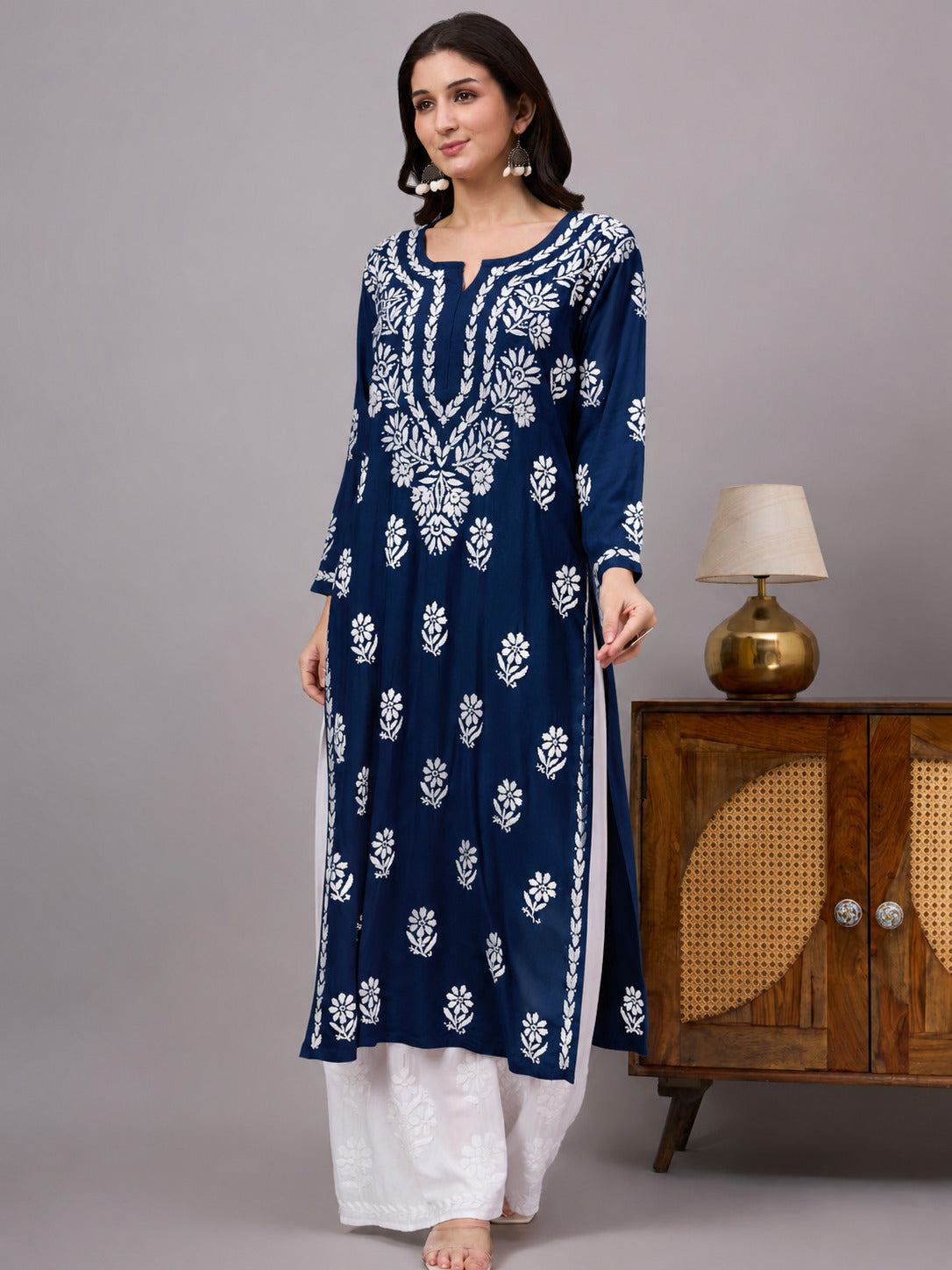 Comfortable regular wear Rayon Straight Kurti with authentic handcrafted Chikankari embroidery, traditional craftsmanship, and modern ethnic fashion suitable for every season.