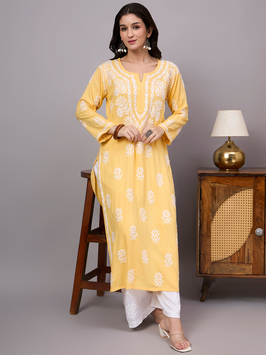 Women's trending kurti crafted from breathable rayon fabric featuring authentic handcrafted Chikankari embroidery and elegant ethnic detailing.