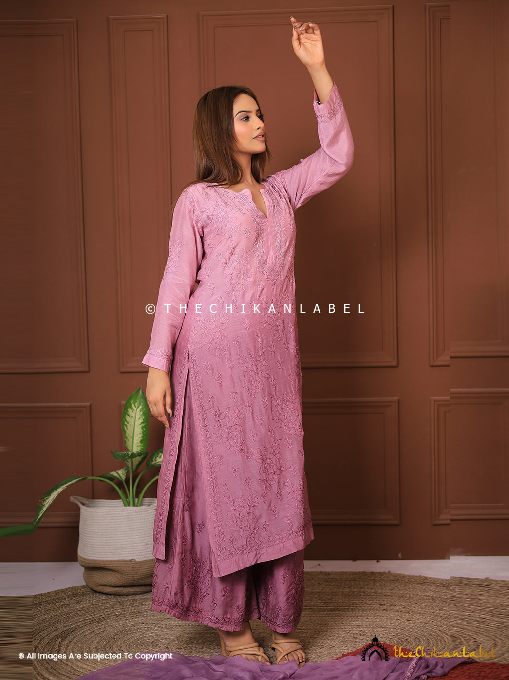 Woman wearing mauve chikankari muslin kurta set with dupatta