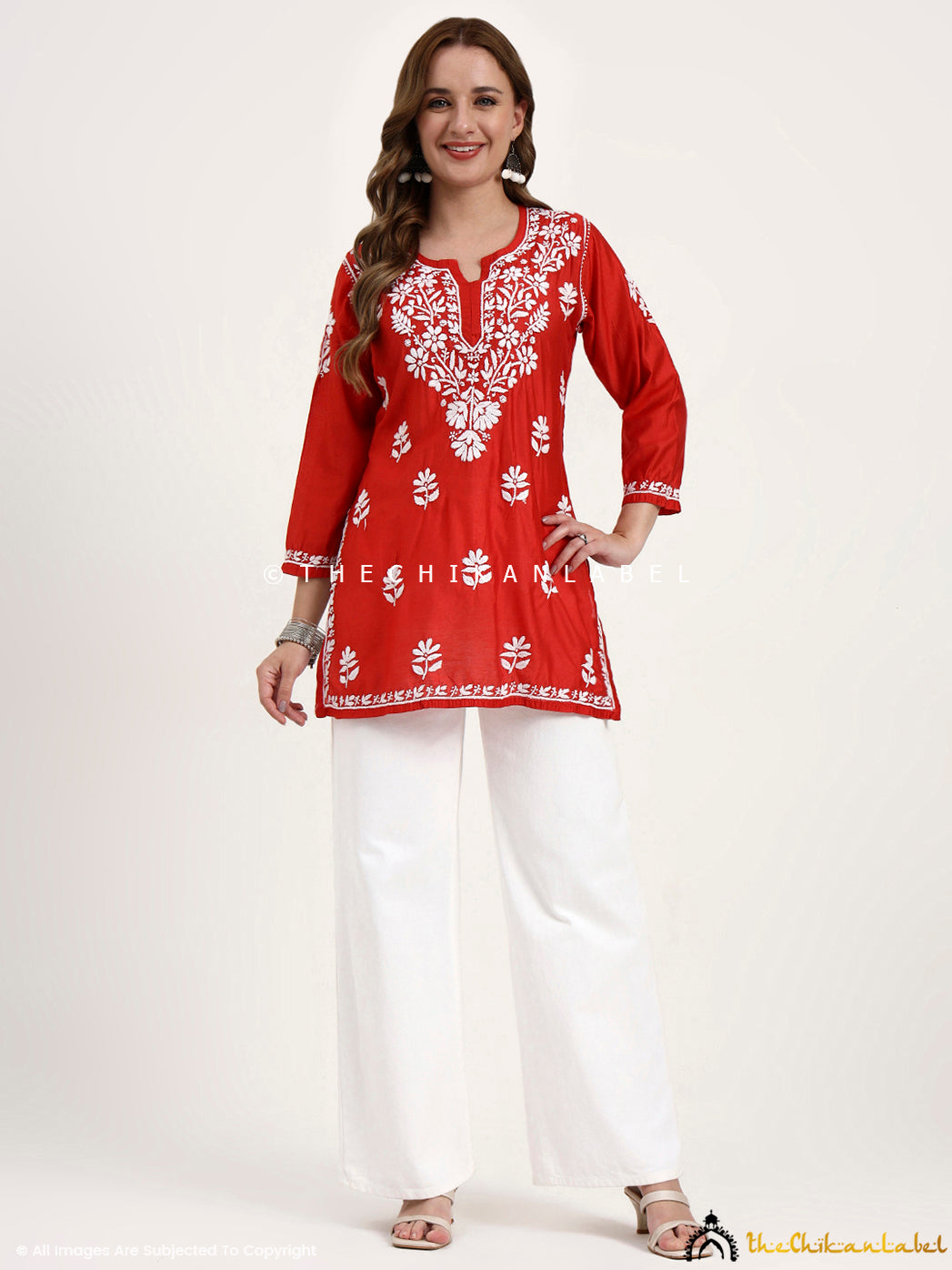 Chanderi chikankari short kurti showcasing floral embroidery patterns designed by artisans of Lucknow.