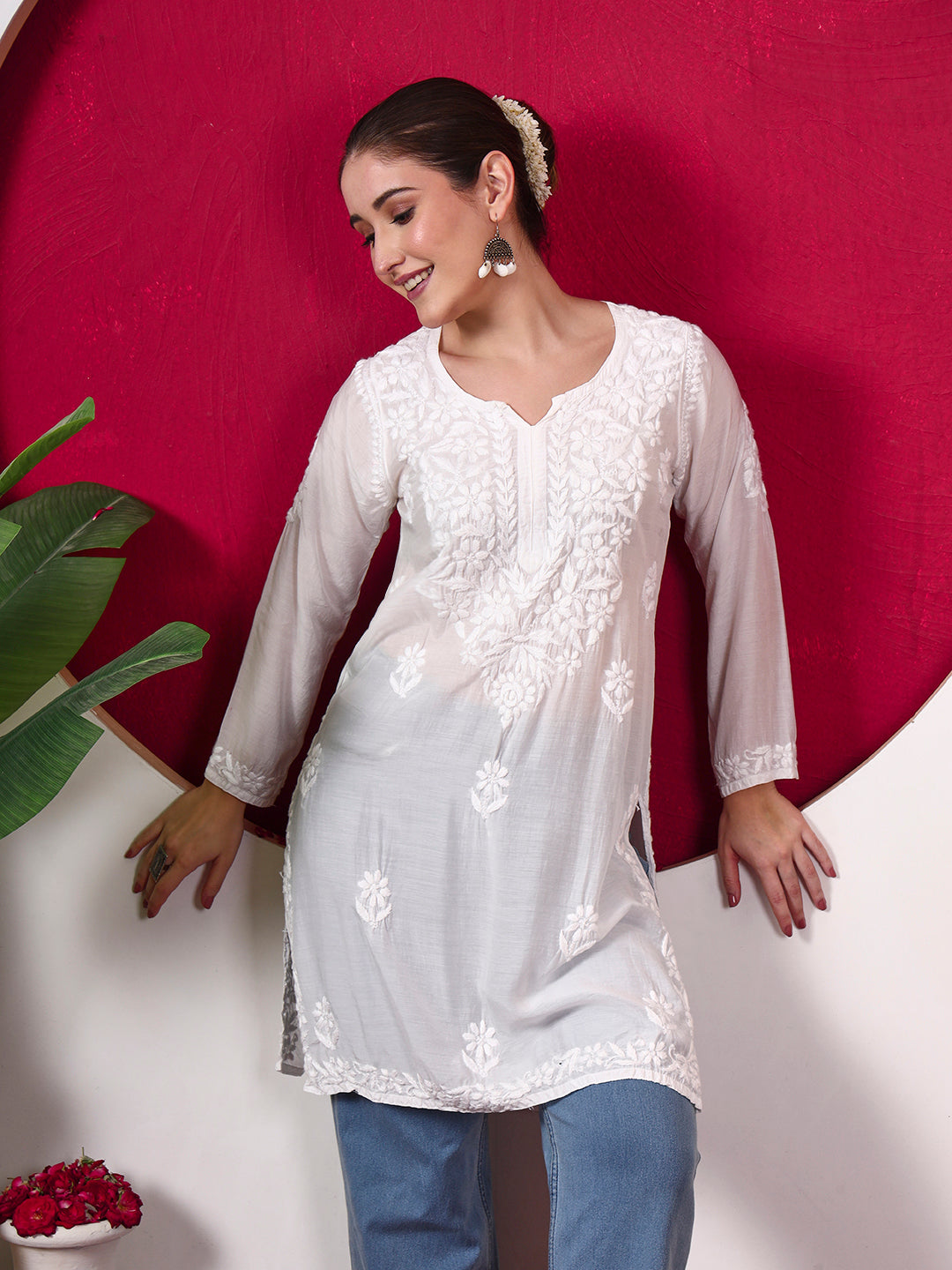 Megha Muslin Straight Kurti showcasing floral Chikankari embroidery and handcrafted-inspired detailing with a lightweight fabric suitable for everyday styling.