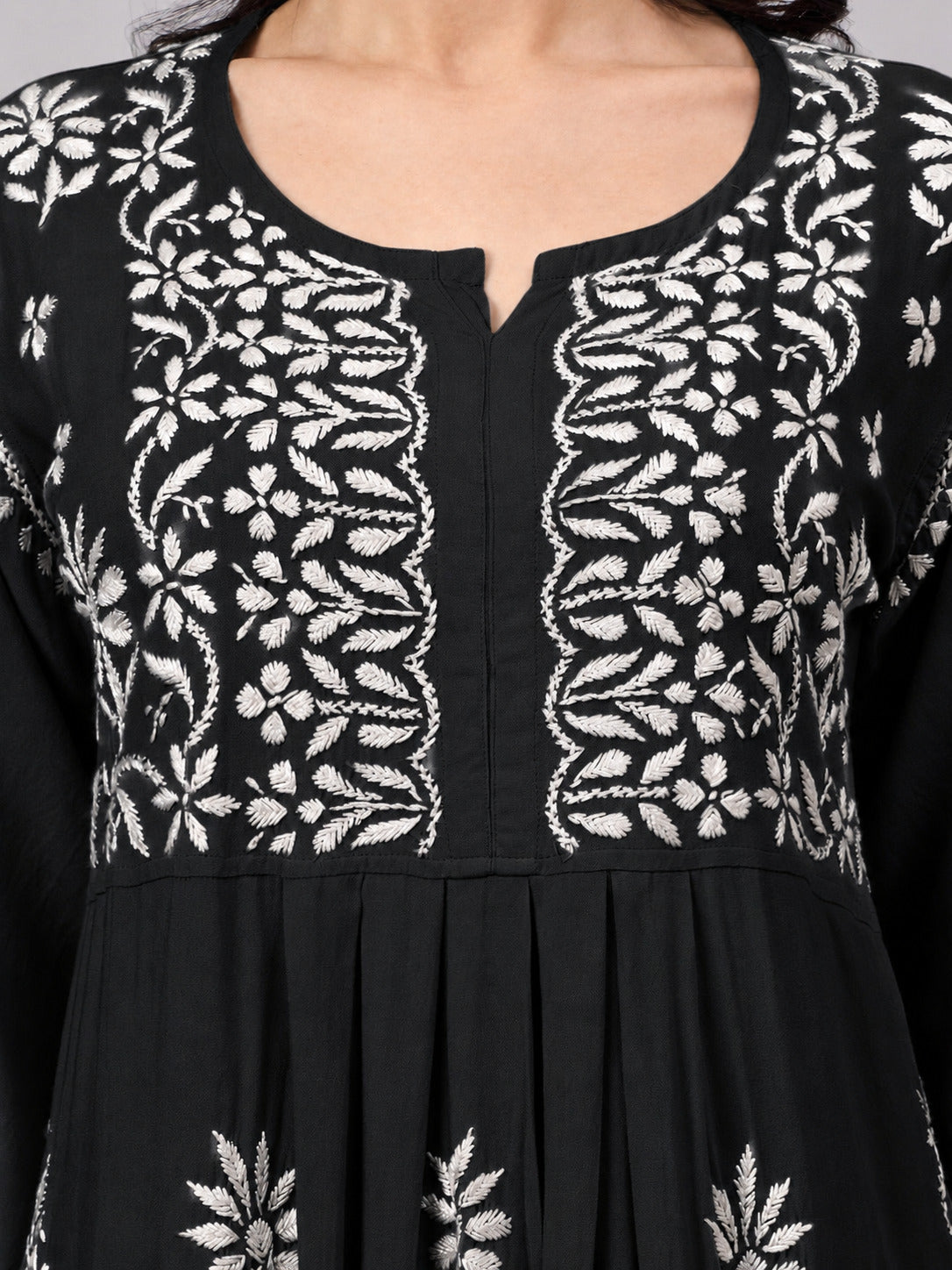 Handcrafted trending kurta set featuring authentic Chikankari embroidery, premium rayon construction, elegant A-line styling, and coordinated palazzo for contemporary ethnic wardrobes.