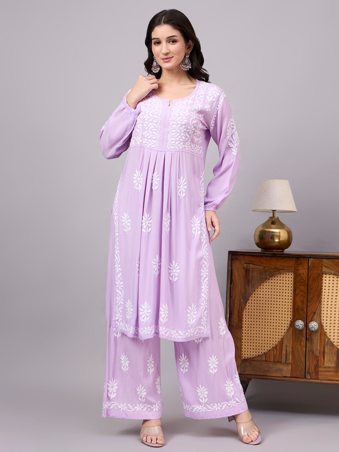 Women's handcrafted Chikankari Set designed with intricate floral embroidery, an A-line kurta, and matching palazzo for effortless ethnic fashion and everyday comfort.