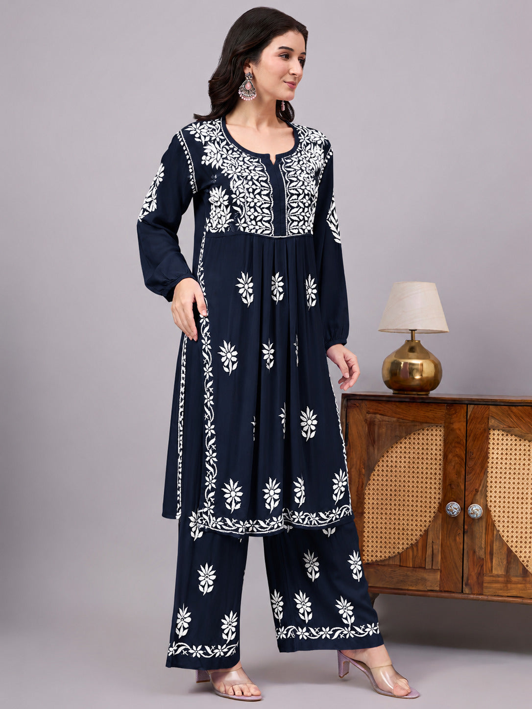 Traditional Rayon A-Line Kurta Set crafted by skilled artisans using authentic Chikankari embroidery techniques, paired with an embroidered palazzo for a complete ethnic ensemble.
