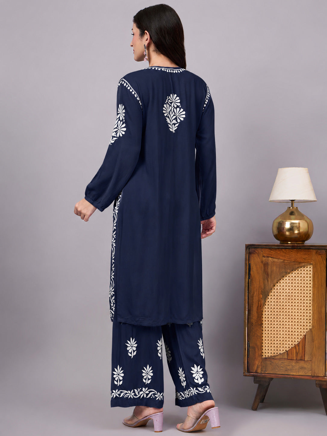 Women's handcrafted Chikankari Set designed with intricate floral embroidery, an A-line kurta, and matching palazzo for effortless ethnic fashion and everyday comfort.