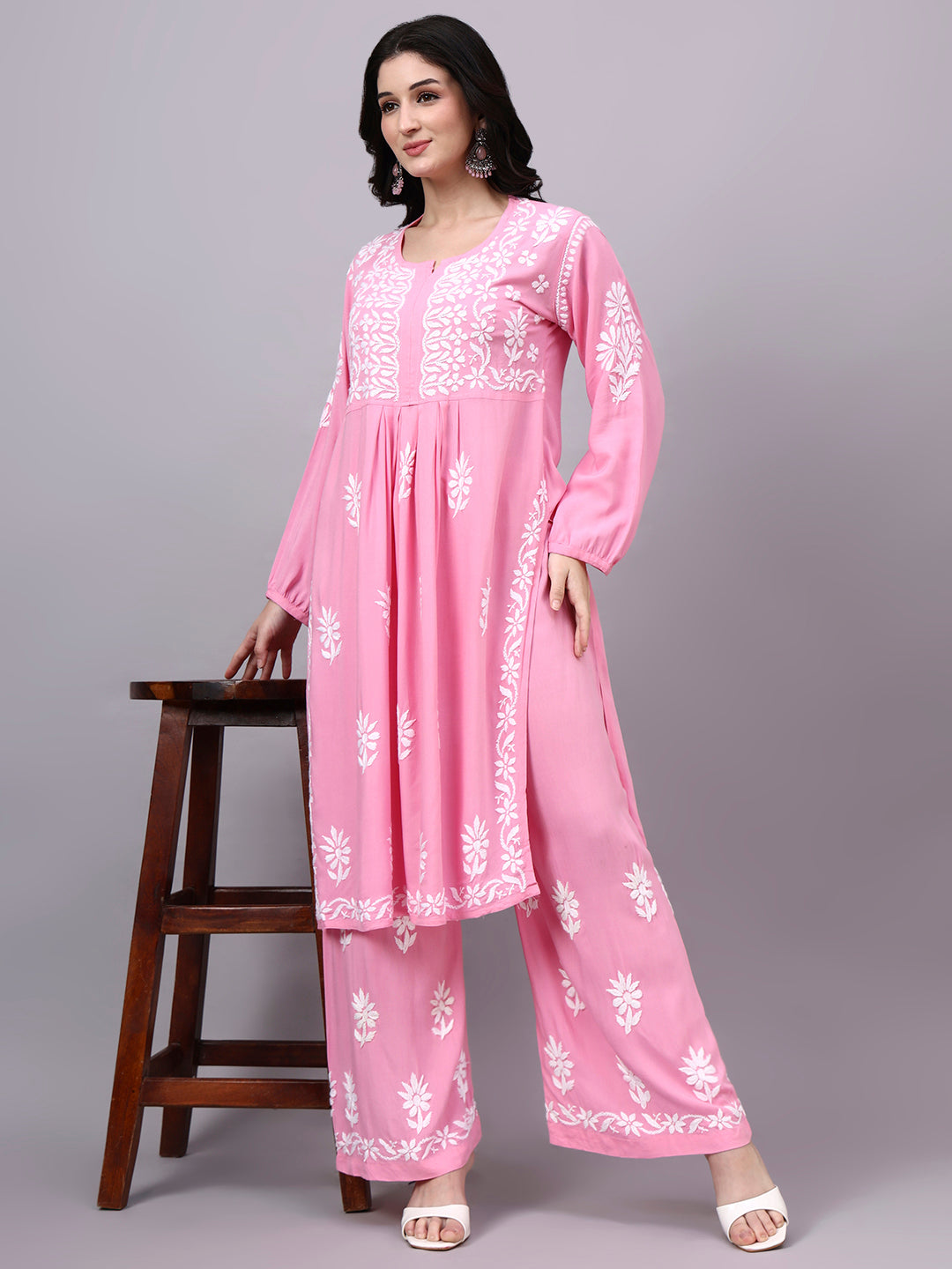 Handcrafted trending kurta set featuring authentic Chikankari embroidery, premium rayon construction, elegant A-line styling, and coordinated palazzo for contemporary ethnic wardrobes.