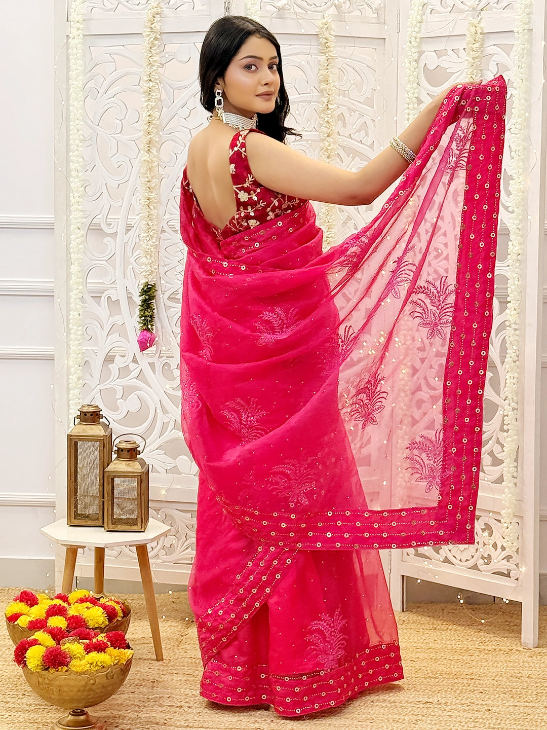 Festive wear saree featuring delicate mukaish work and authentic chikankari embroidery handcrafted by artisans.