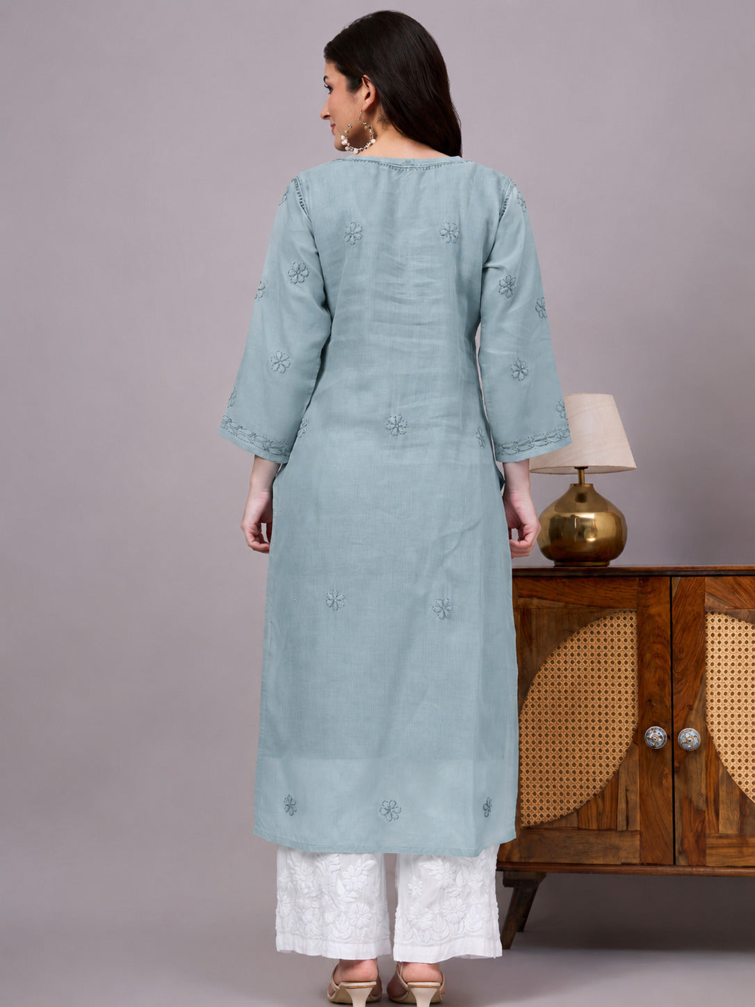 Women's trending kurti featuring handcrafted Lucknow Chikankari embroidery, premium cotton construction, soft inner lining, and elegant straight-fit styling.