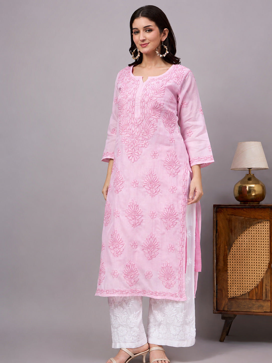 Women's handcrafted Cotton Straight Kurti with authentic floral Chikankari embroidery, comfortable regular fit, and breathable fabric for daily wear and festive occasions.