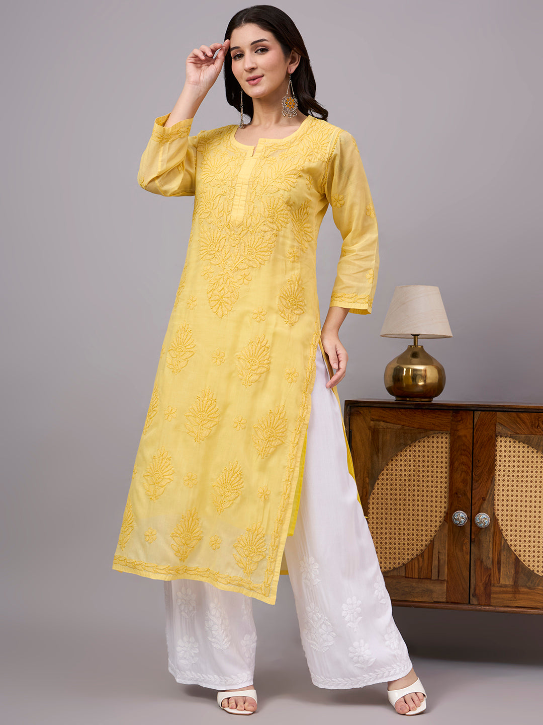 Women's handcrafted Cotton Straight Kurti with authentic floral Chikankari embroidery, comfortable regular fit, and breathable fabric for daily wear and festive occasions.