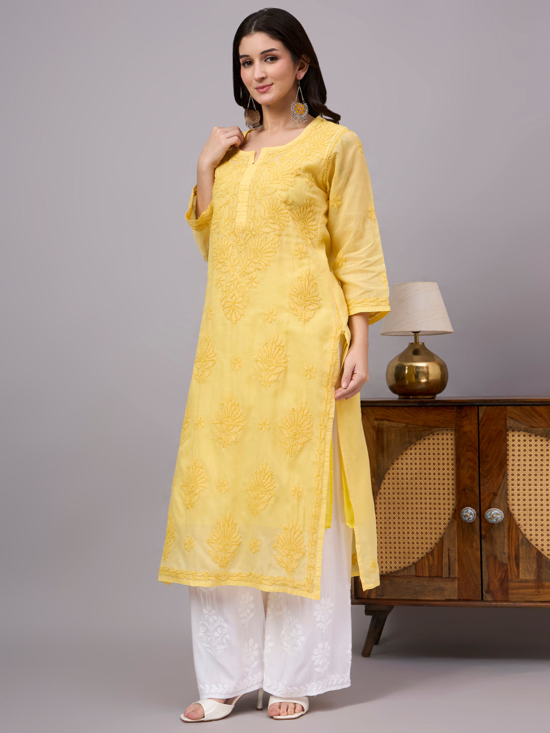 Women's trending kurti featuring handcrafted Lucknow Chikankari embroidery, premium cotton construction, soft inner lining, and elegant straight-fit styling.