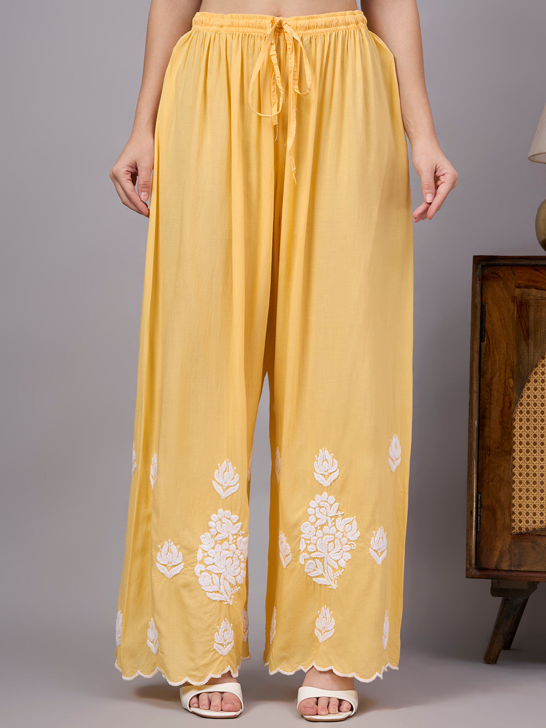 Elegant comfortable regular wear set designed with premium modal fabric, handcrafted Chikankari work, straight kurti style, and matching embroidered palazzo.