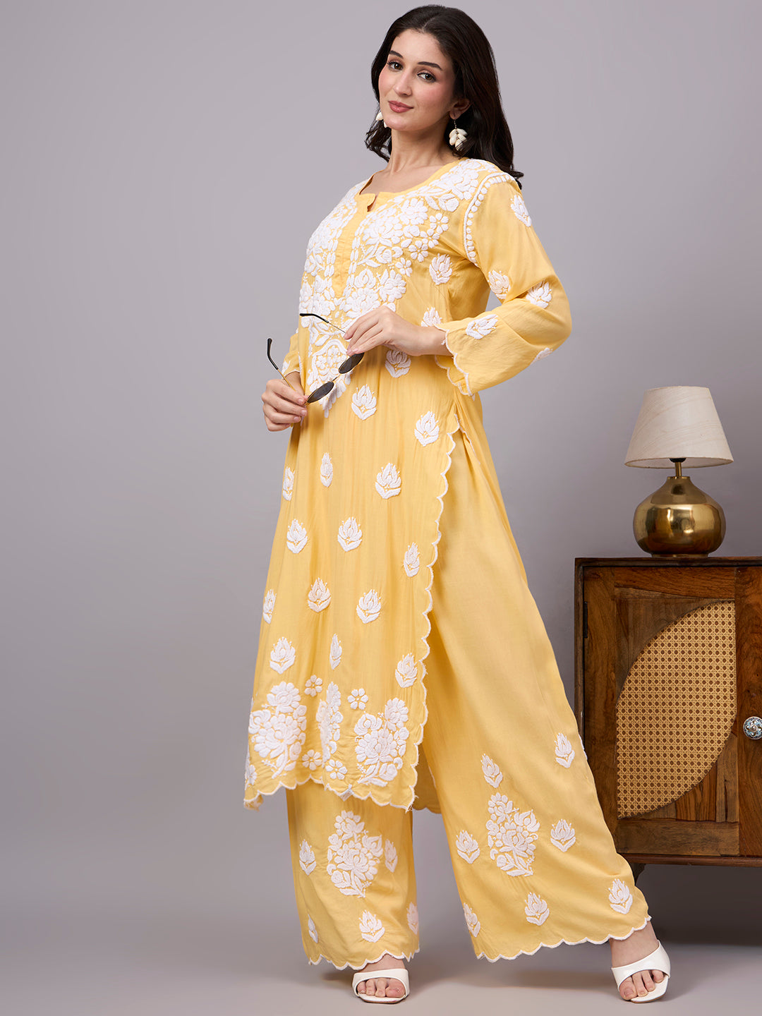 Women's trending Chikankari set showcasing artisan-made embroidery, soft modal construction, and a classic ethnic design suitable for modern wardrobes.