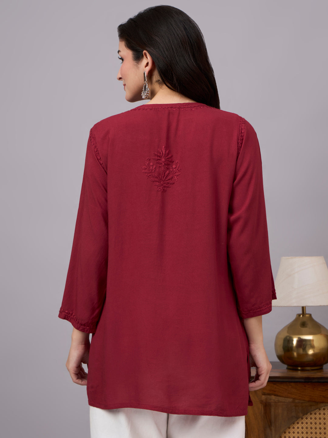 Trending Chikankari top for women with handcrafted embroidery details, soft rayon texture, and elegant short kurta design for casual occasions
