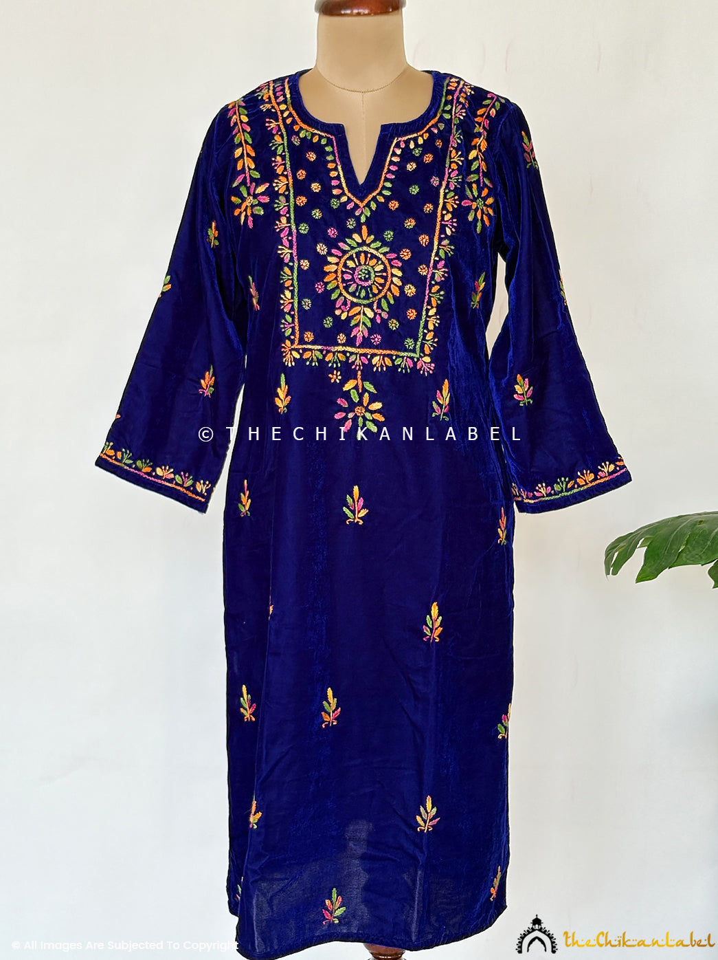 Premium velvet chikankari straight kurta with traditional handcrafted embroidery showcased on a model for elegant festive styling.