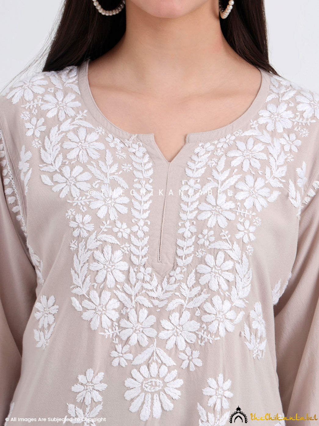 Close-up of neckline detailing on a chikankari rayon short top, highlighting intricate embroidery and everyday styling.