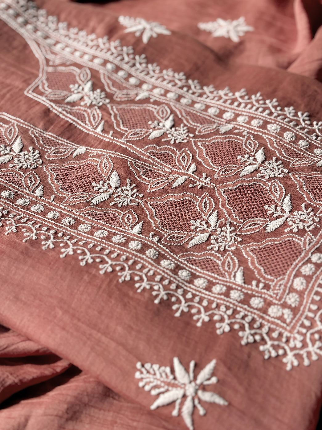 “Close-up of artisan hand embroidery on mulmul unstitched chikankari kurti piece with matching dupatta”