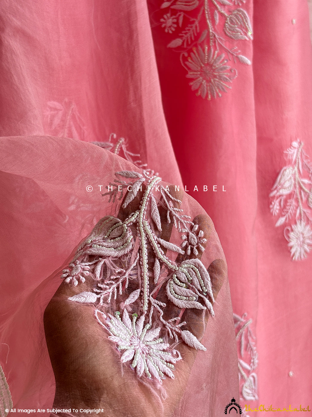 Premium organza chikankari pearl work saree crafted by artisans with detailed embroidery, offering comfort, tradition, and festive elegance.