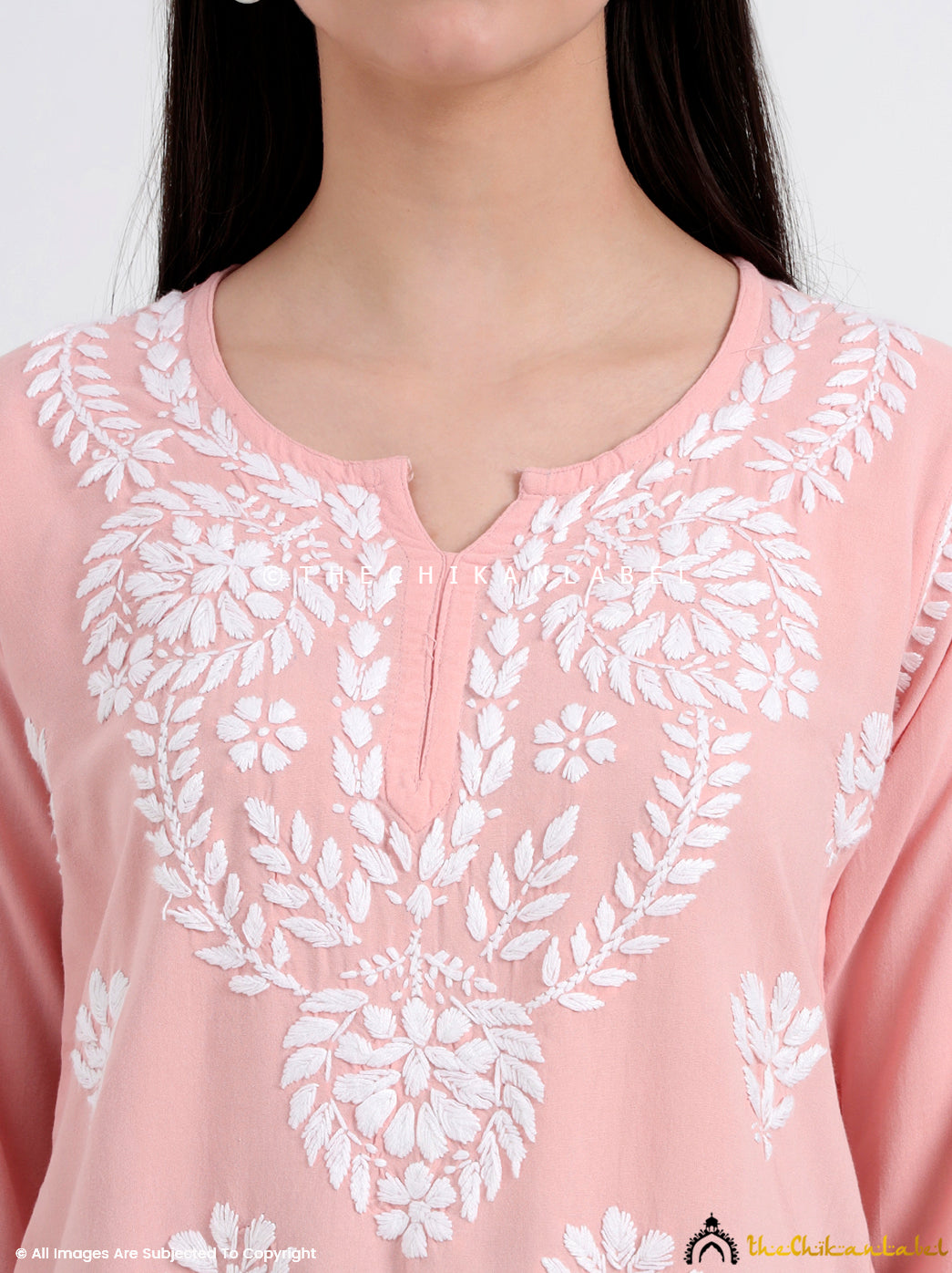 Trending short kurti-style top with chikankari embroidery, paired with casual bottoms for an easy-going ethnic outfit.