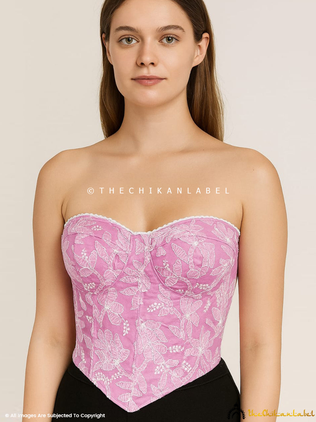 Elegant off-shoulder corset top with handcrafted Chikankari embroidery and floral motifs.