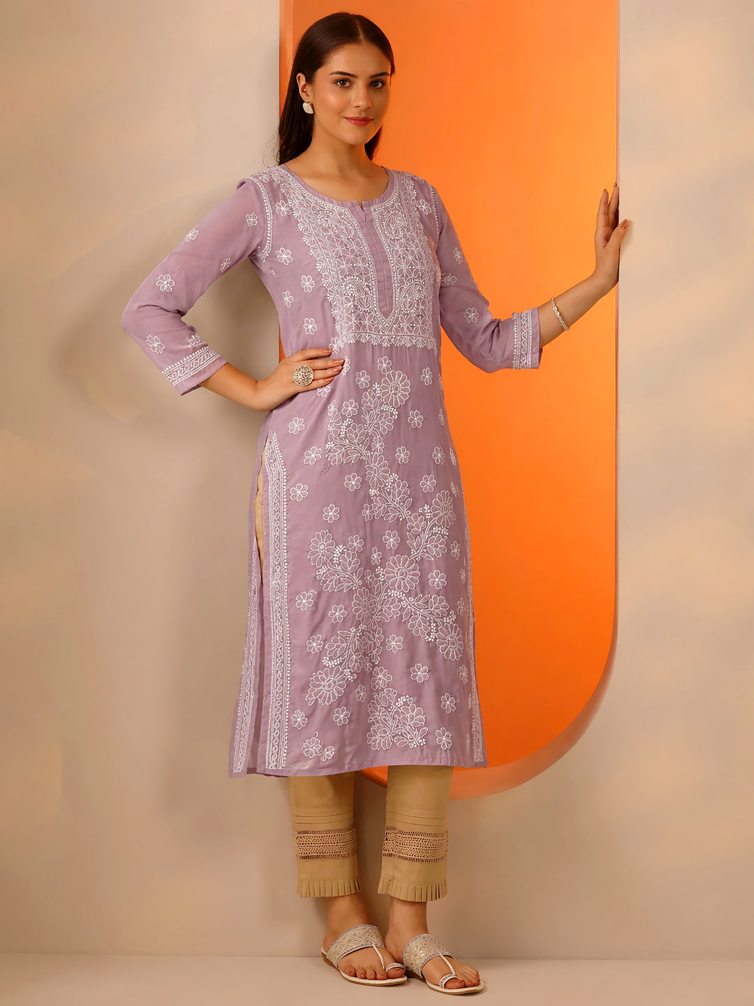 Women wearing cotton straight kurti with intricate chikankari embroidery in a comfortable regular wear ethnic outfit