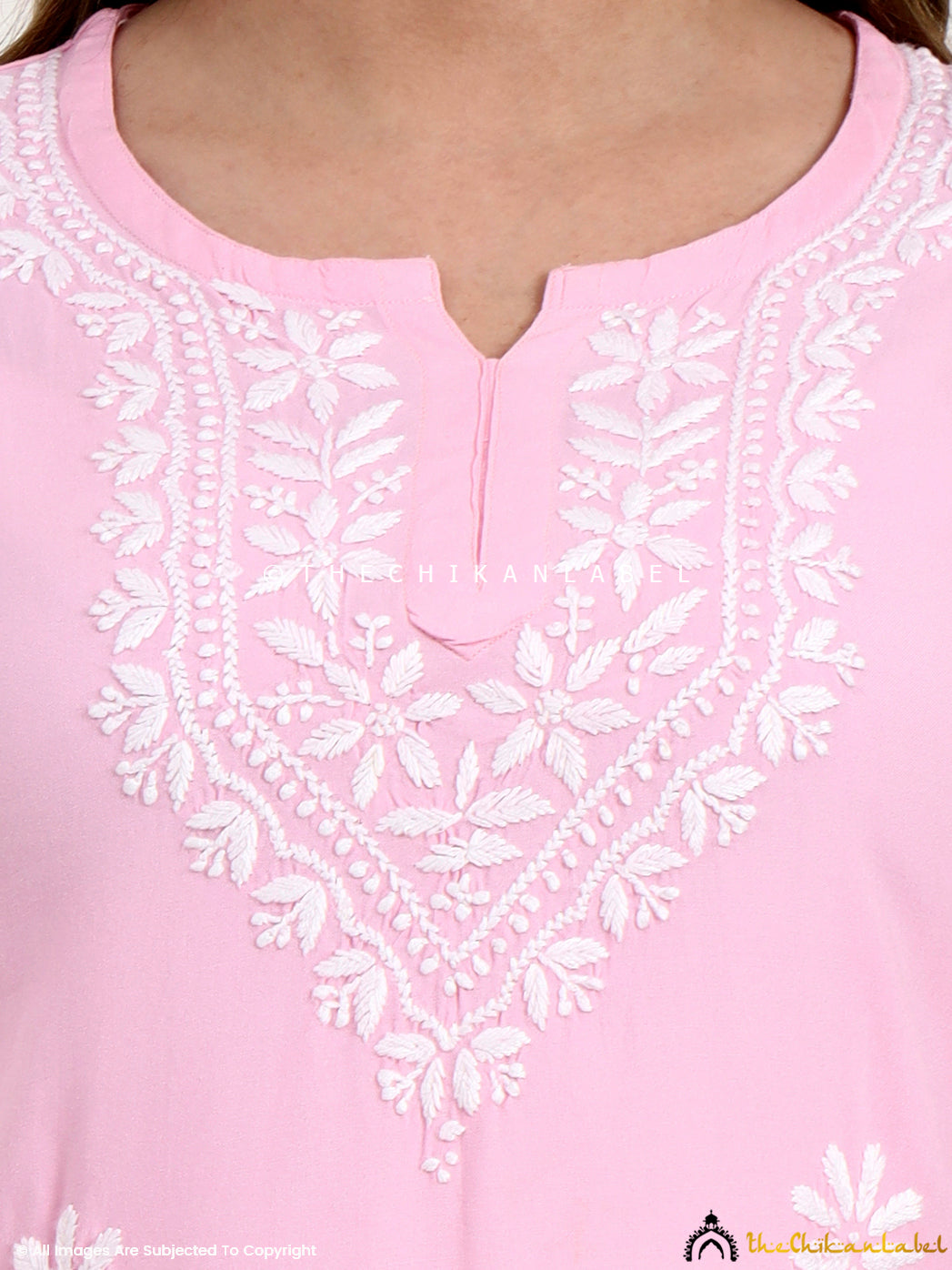 Trending chikankari short top in rayon fabric featuring traditional floral embroidery.