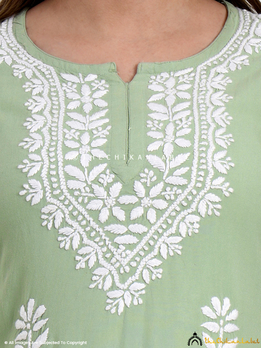 Elegant short top in rayon with chikankari thread work, ideal for office and events.