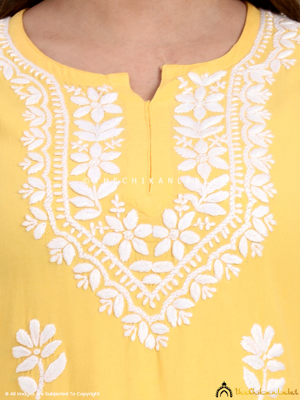 Trending chikankari short top in rayon fabric featuring traditional floral embroidery.