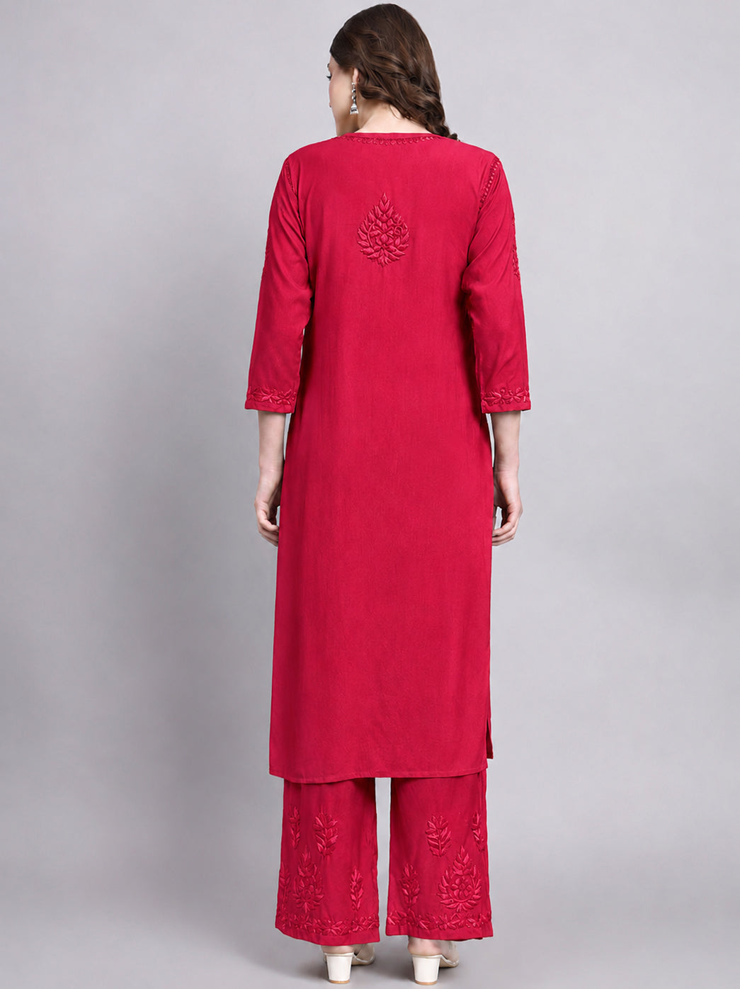 Women’s chikankari kurta set with matching palazzo featuring detailed floral embroidery and a straight silhouette suitable for festive and everyday wear.