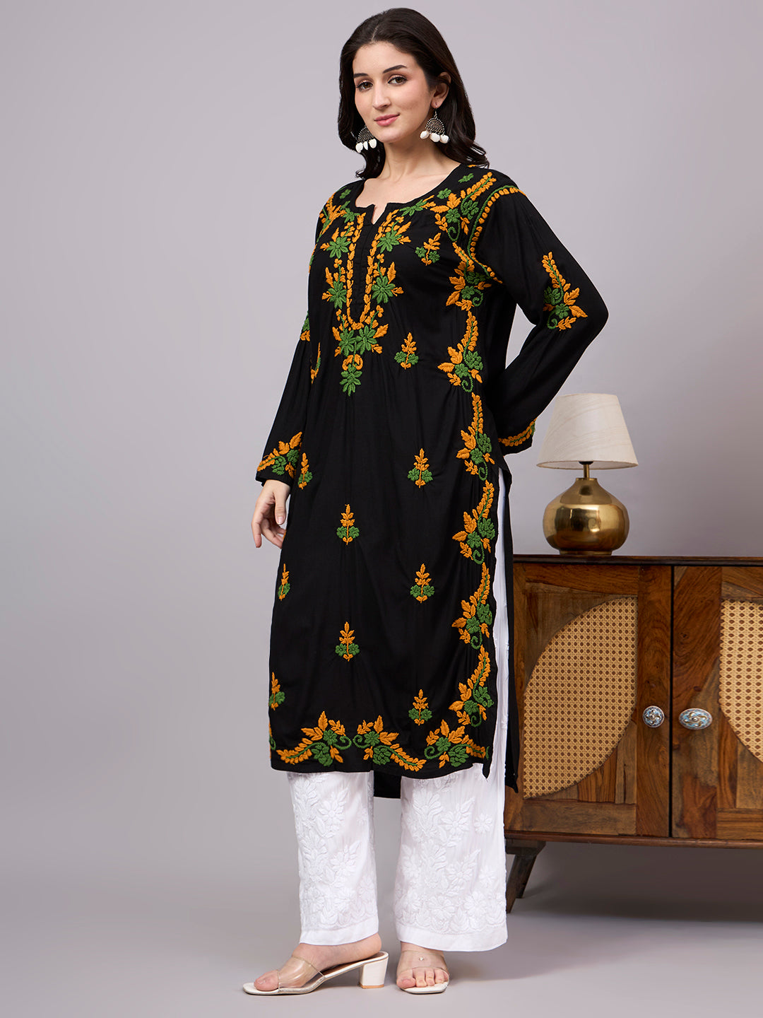 Handcrafted Chikankari Kurta for women featuring intricate artisan embroidery, breathable rayon fabric, full sleeves, and elegant straight-cut styling for effortless comfort.
