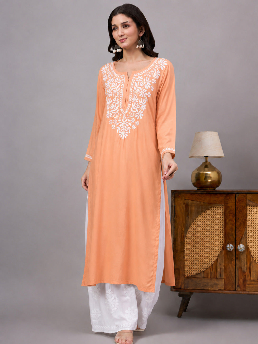 Women's ethnic rayon kurti with classic Lucknowi Chikankari embroidery, lightweight fabric, and a comfortable straight fit suitable for daily wear and office attire.