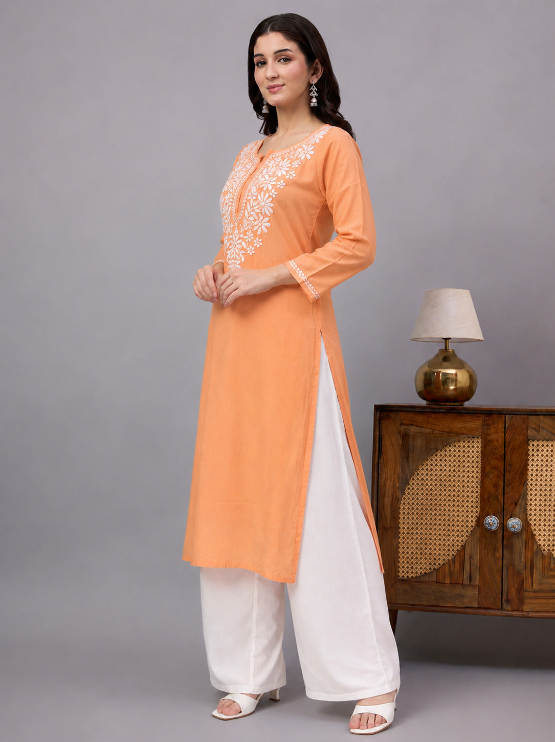 Premium embroidered rayon straight kurti featuring intricate Chikankari work, lightweight fabric, and a comfortable silhouette ideal for modern women seeking everyday style.