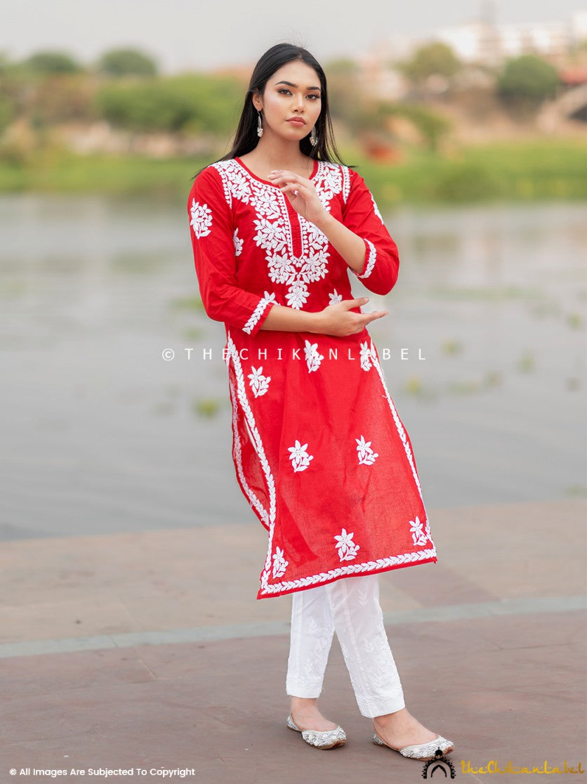 Woman wearing red Chikankari cotton kurti with white embroidery