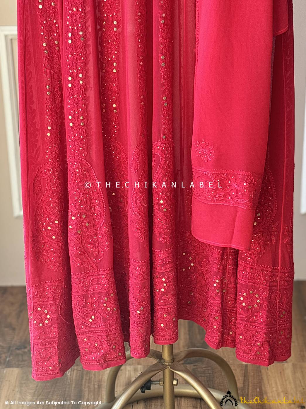 Bright red ethnic outfit with handcrafted embroidery and mirror accents