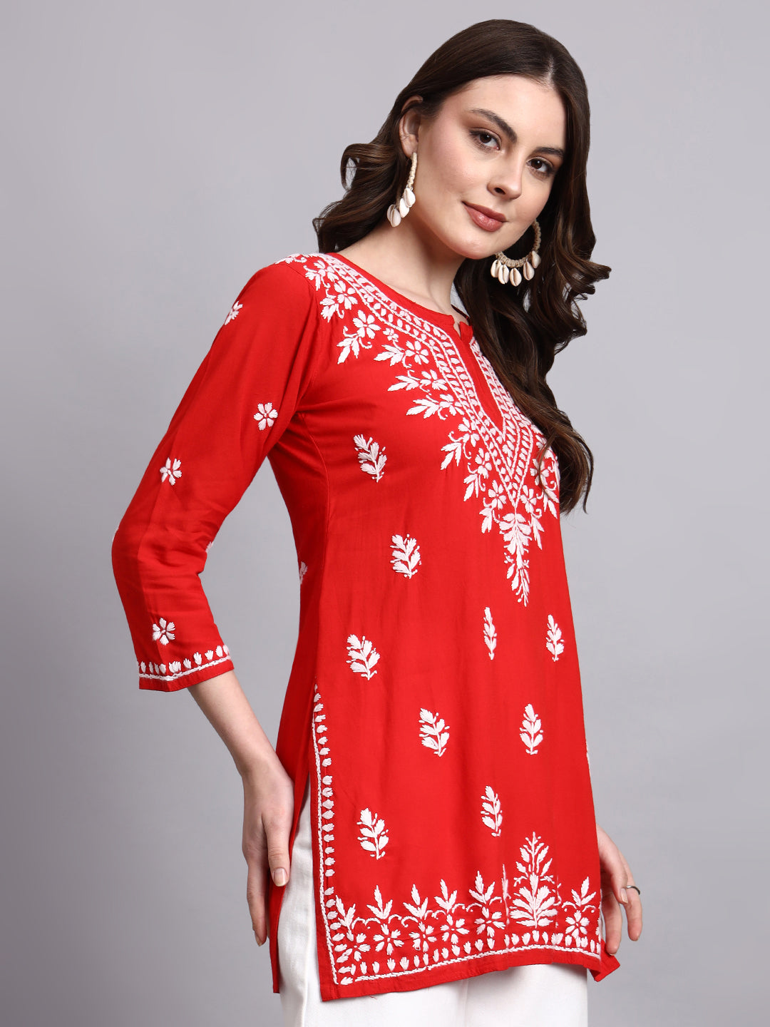 Women’s rayon short kurta with intricate chikankari embroidery suitable for summer wear and layering