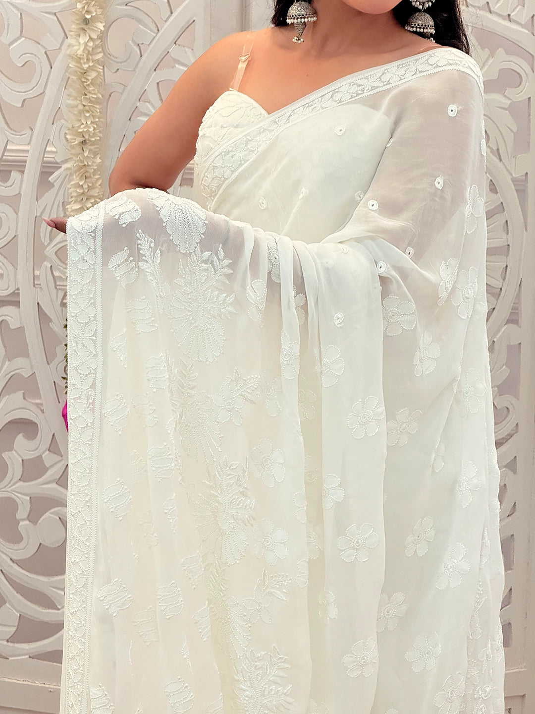 Hand-embroidered viscose chikankari saree styled with traditional motifs and delicate thread work.